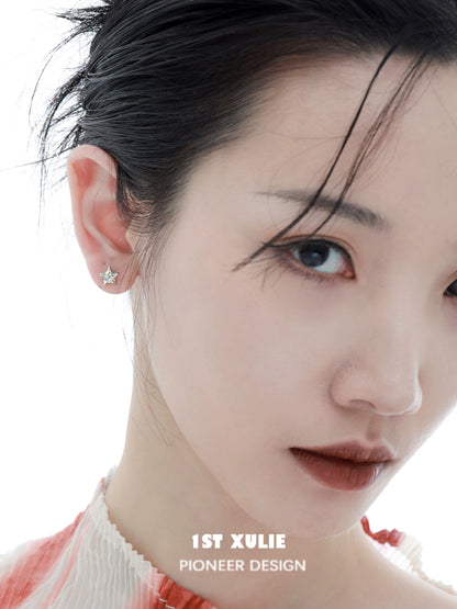 Elegant cosmic moon and star earrings for a celestial-inspired look, showcased on a model