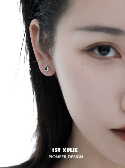 Chic model wearing 1STXULIE cosmic star earrings that add a stylish touch to any outfit