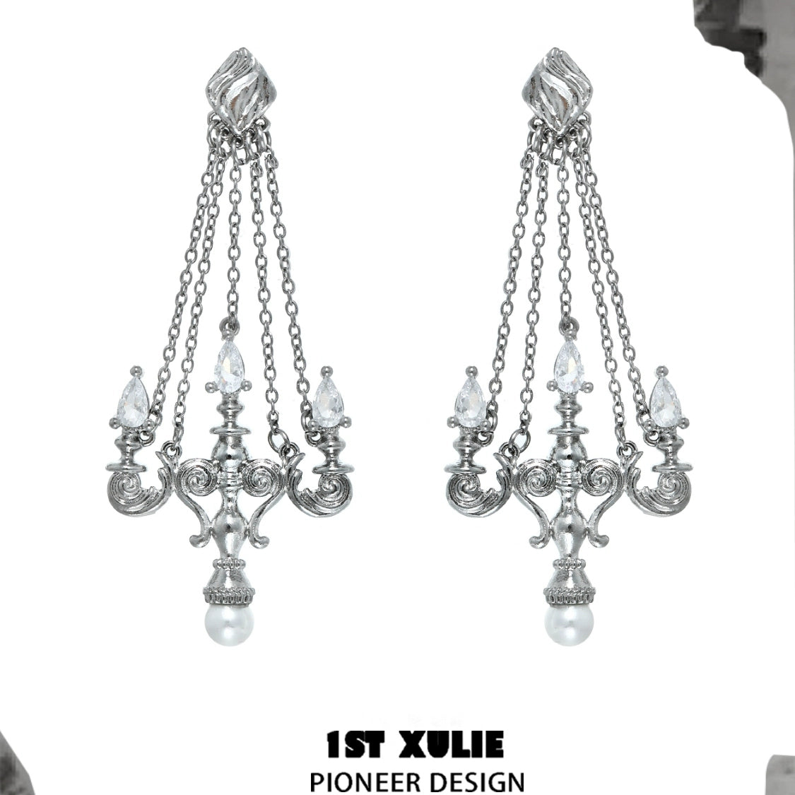 Elegant silver crystal lamp earrings with cascading chains and pearl accents for a stunning look