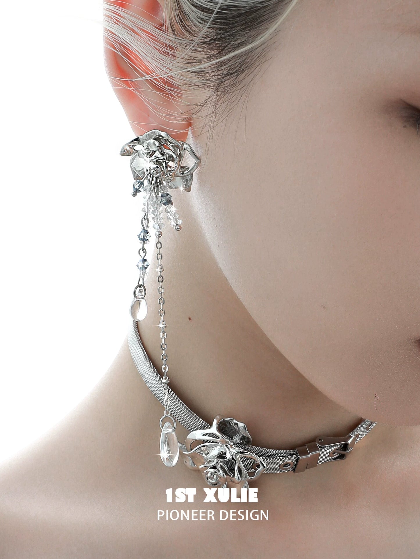 Elegant crystal rose tassel earrings featuring a silver design and intricate chain details