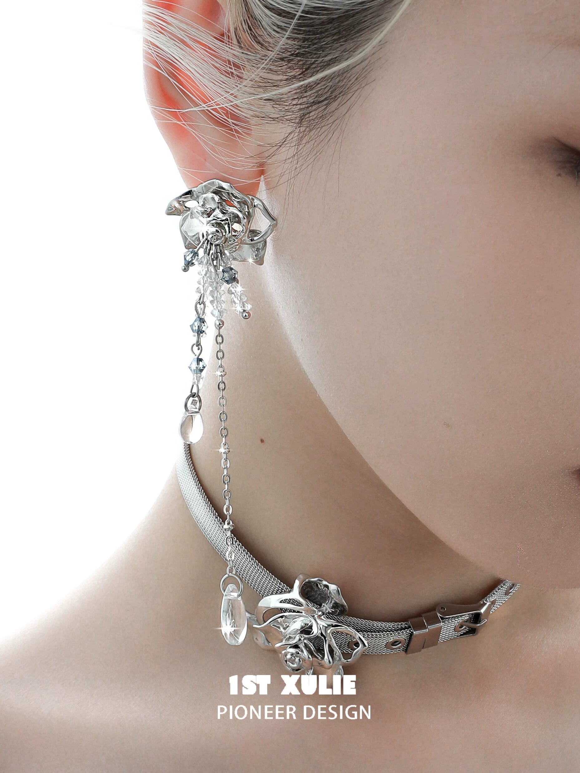 Elegant crystal rose tassel earrings featuring a silver design and intricate chain details