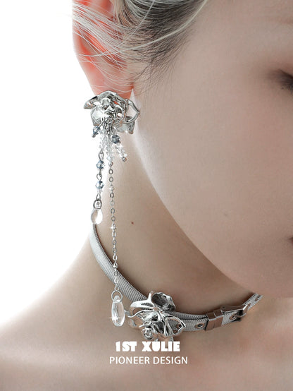 Elegant crystal rose tassel earrings featuring a silver design and intricate chain details