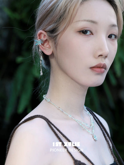 Model wearing crystal tassel ear clips showcasing elegant design and intricate details