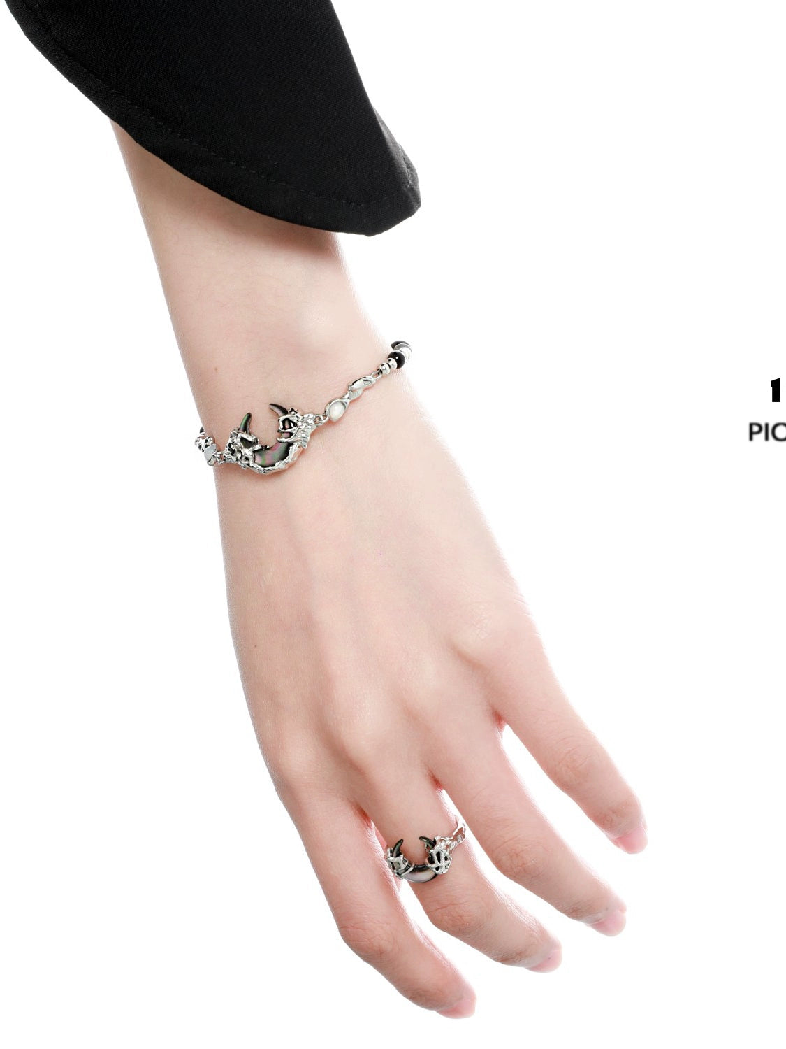 Elegant dark moon agate bracelet with a unique design showcased on a model's wrist