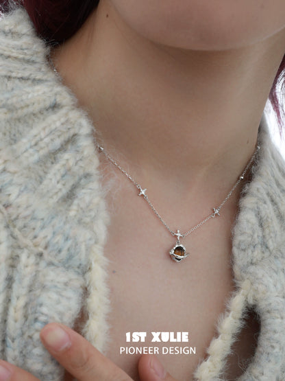 1ST XULIE Desert Planet Necklace featuring a celestial design with stars and a unique pendant