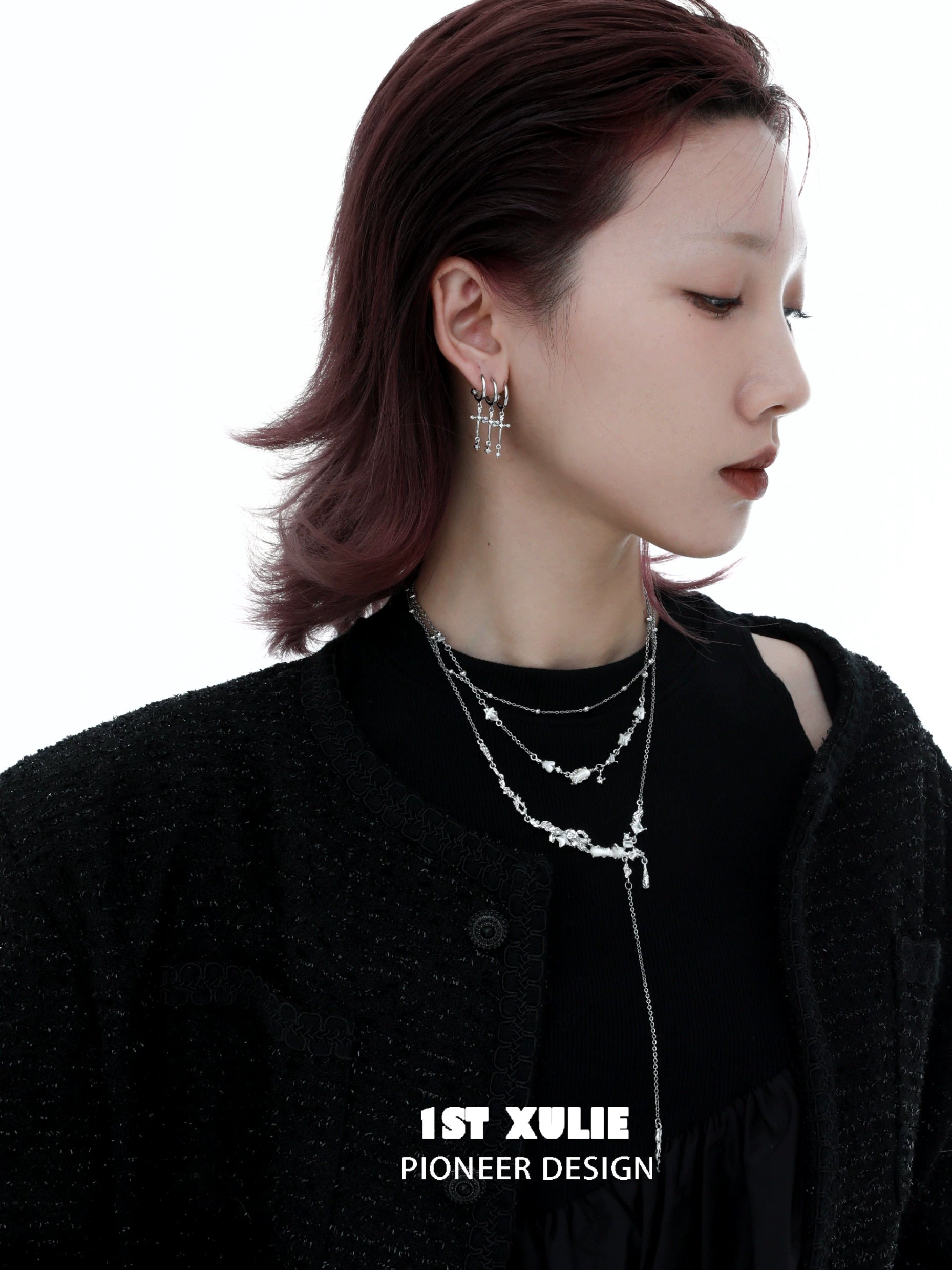 Fashionable model wearing a double layer moon necklace layered with other jewelry for a chic look