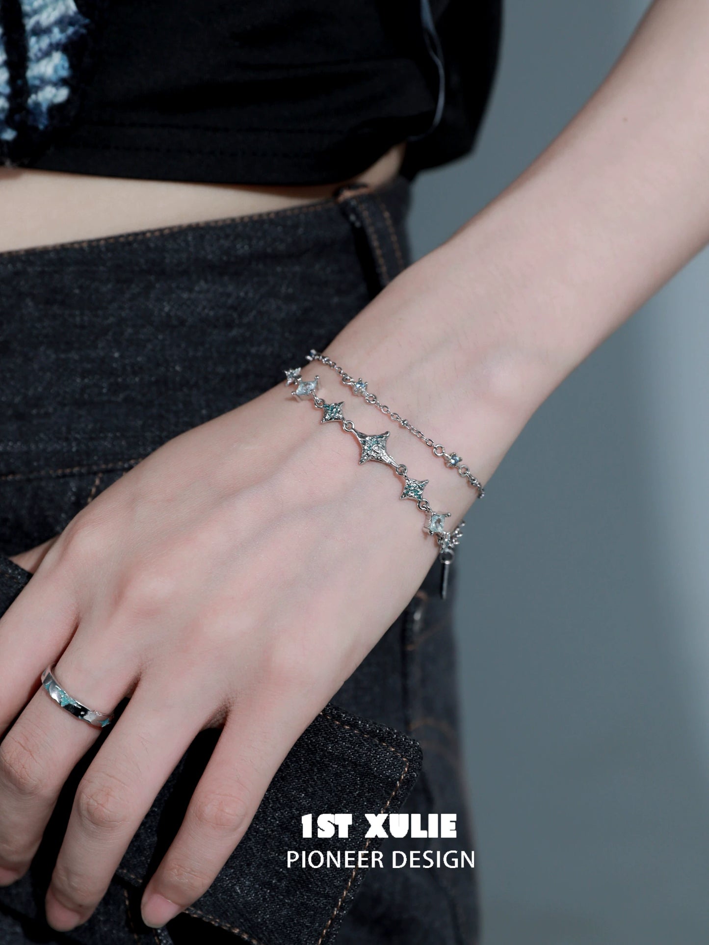 Elegant double layer starfish silver bracelet showcasing shimmering starfish charms on a delicate chain