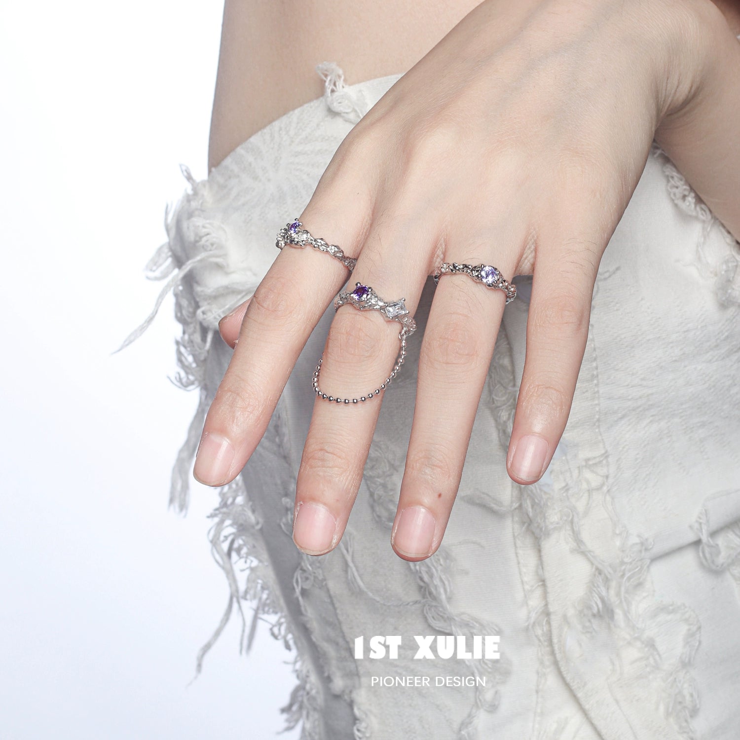 Woman wearing the dream fairy purple zircon ring showcasing intricate design and sparkling stones
