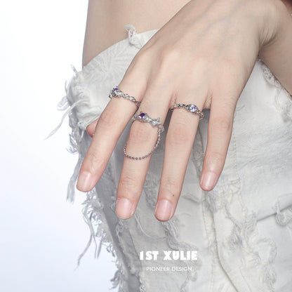 Woman wearing the dream fairy purple zircon ring showcasing intricate design and sparkling stones