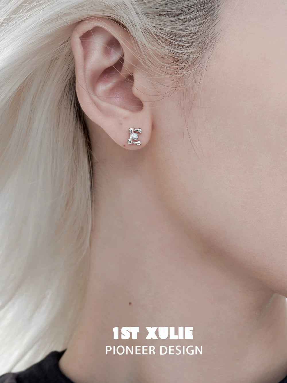Edgy letter silver stud earrings featuring a unique initial design for modern jewelry lovers
