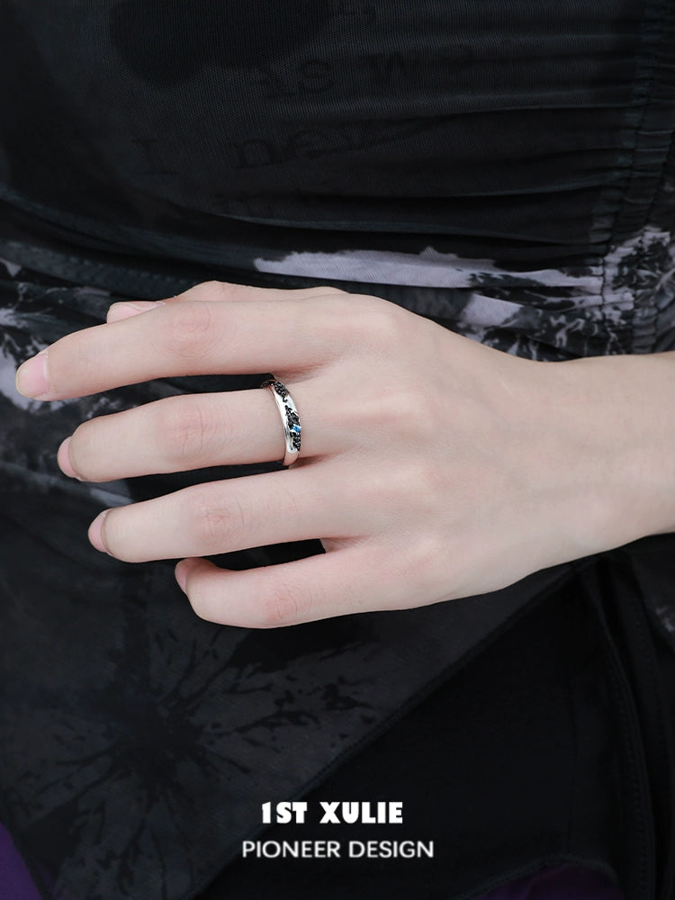 Stylish hand wearing eroded earth couple rings designed by 1STXULIE for modern couples