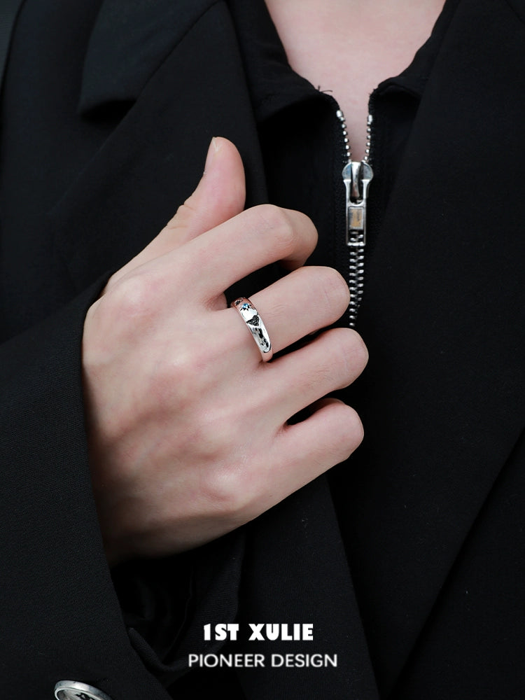 Stylish 1ST XULIE eroded earth couple rings in silver worn on a hand for modern couples