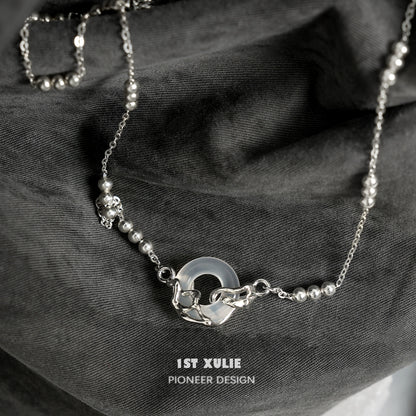Elegant eternal rings silver necklace by 1STXULIE featuring a unique design with beads and a circular pendant
