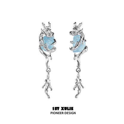 Fantasy dragon earrings featuring a silver design with blue accent stones for a magical look