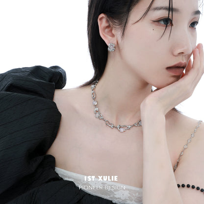 Model wearing a frost goddess beaded necklace paired with elegant earrings for a sophisticated look