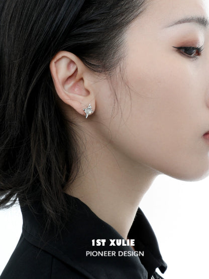 Elegant frozen star agate earrings set against a model's ear, showcasing their unique design and sparkling beauty