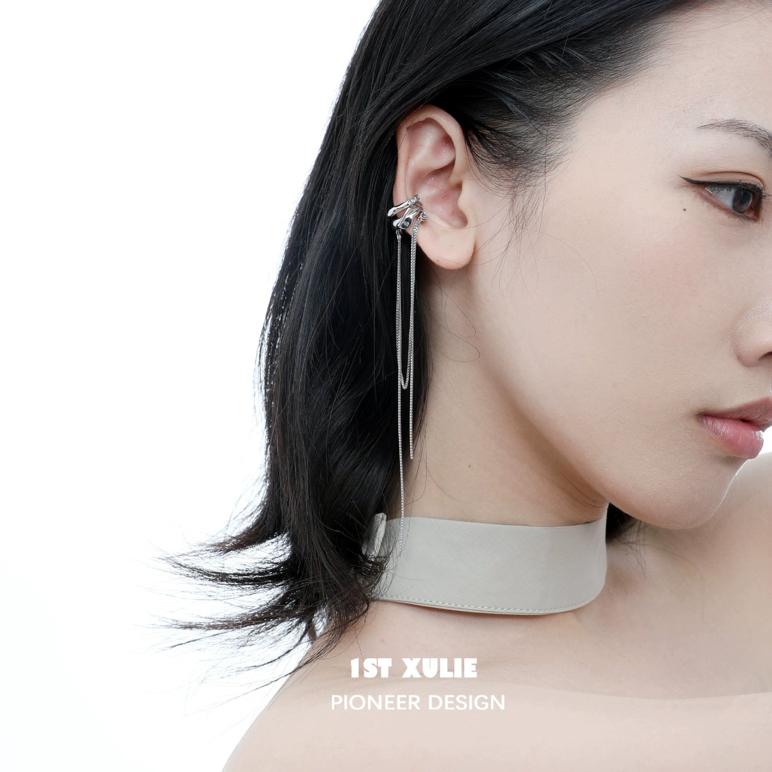 Fashionable frozen tassel ear clip displayed on a model with elegant hairstyle
