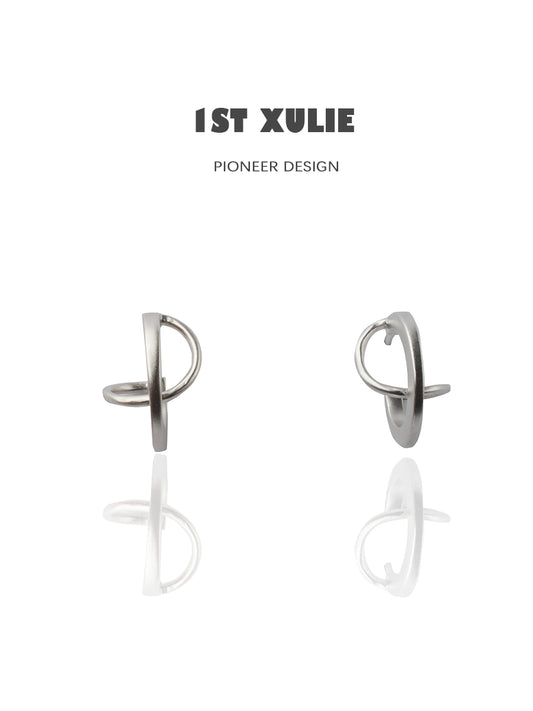Futuristic silver geometric earrings with a modern design and polished finish