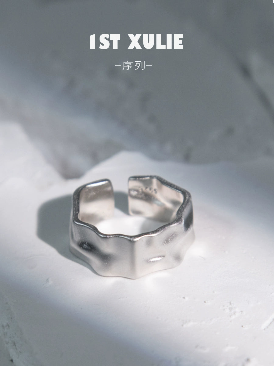 Futuristic silver ring with a unique, textured design, perfect for modern fashion enthusiasts