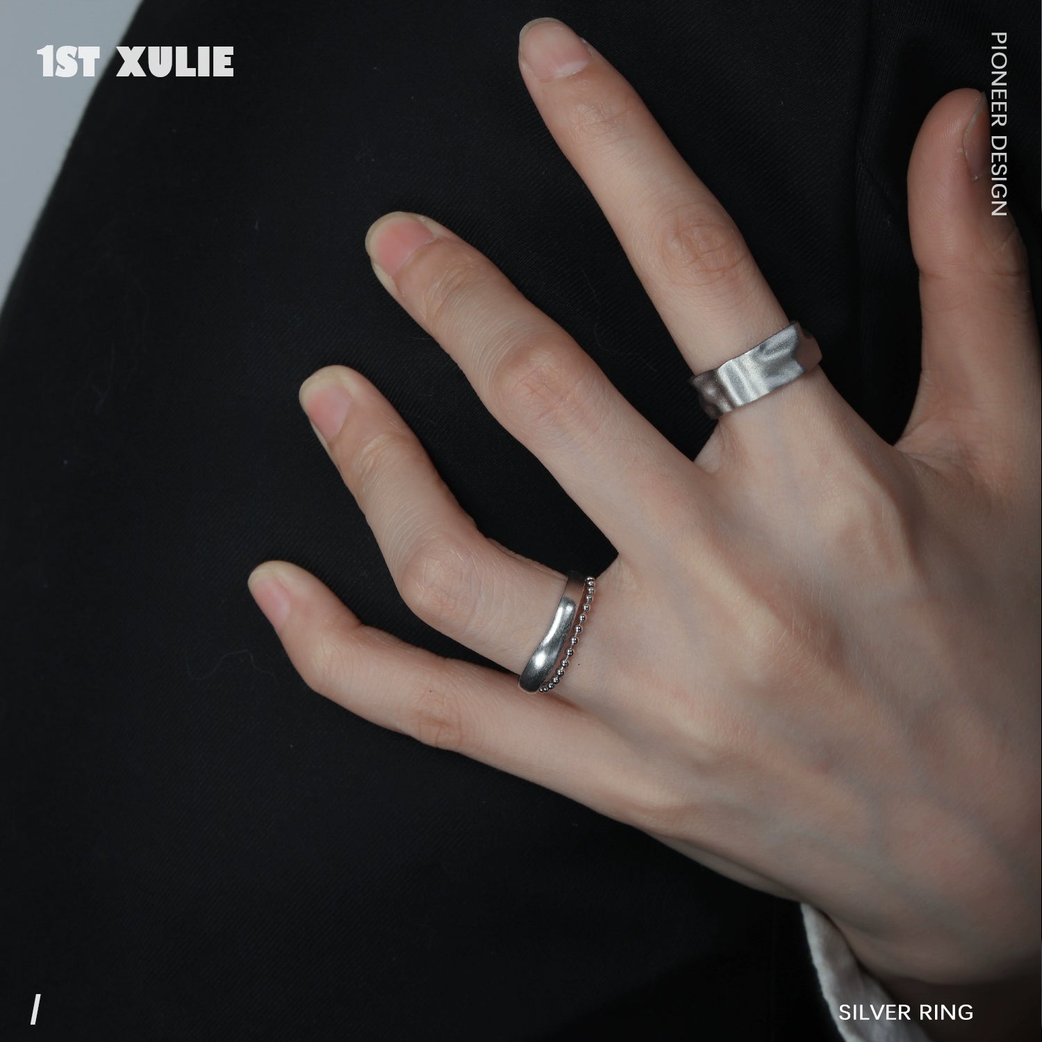 Futuristic silver ring showcased on a hand, emphasizing sleek design and modern aesthetics