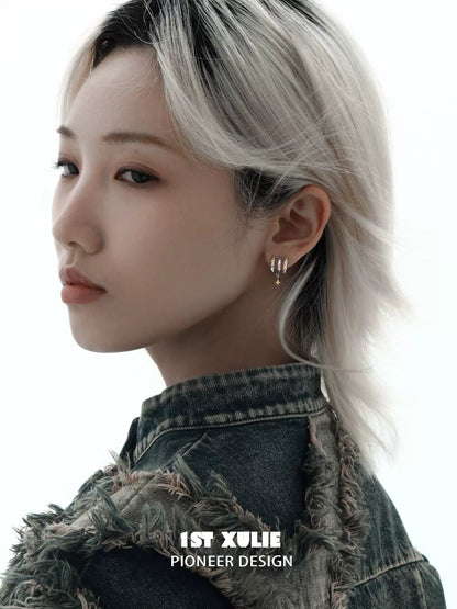 Stylish model showcasing 1ST XULIE galactic star earrings in a modern setting