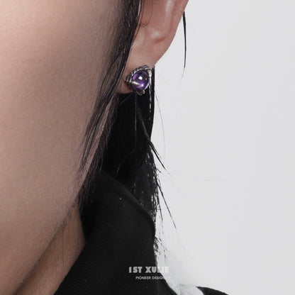 Gothic amethyst stud earrings with a unique design, perfect for a bold fashion statement