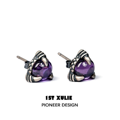 Gothic amethyst stud earrings featuring a unique claw design with a gemstone center
