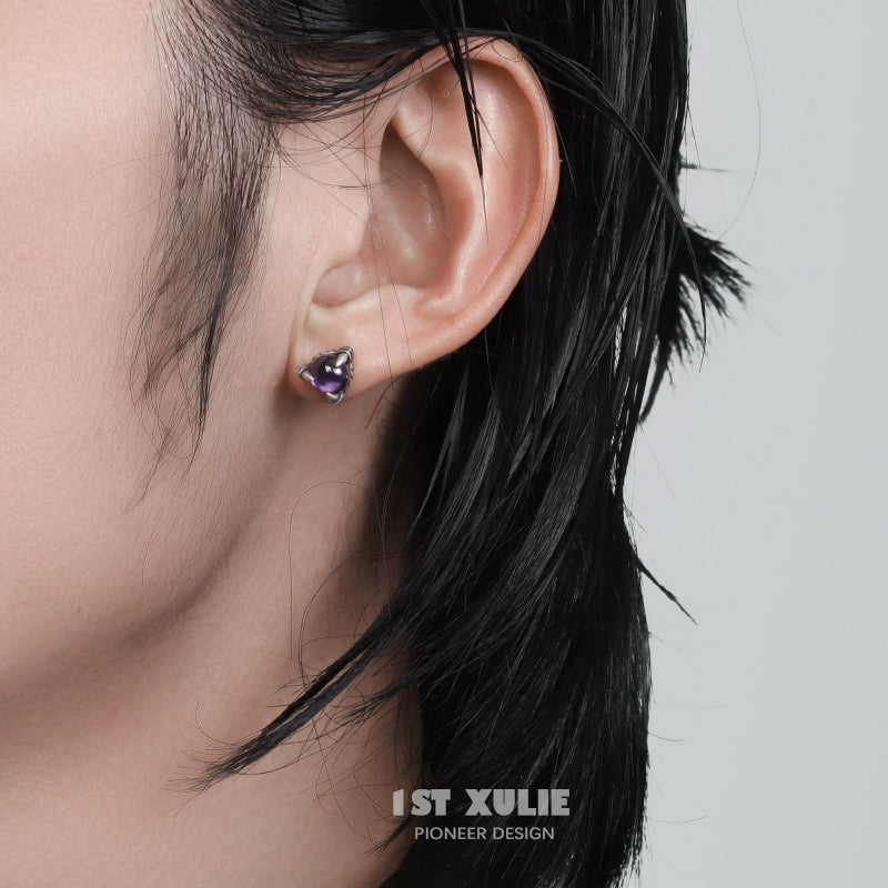 Gothic amethyst stud earrings showcased on a model with short black hair