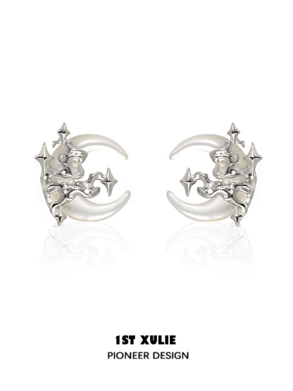 Silver gothic moon earrings featuring intricate designs and star accents for a unique look