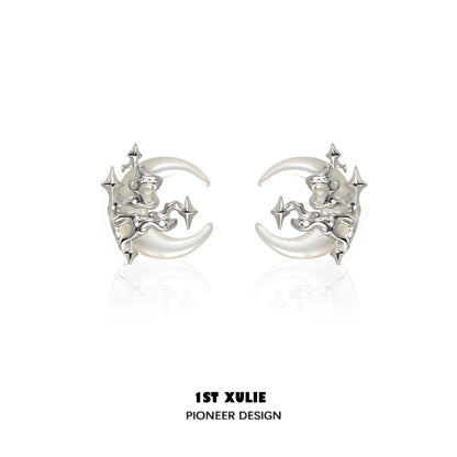 Silver gothic moon earrings featuring a unique celestial design with intricate star details