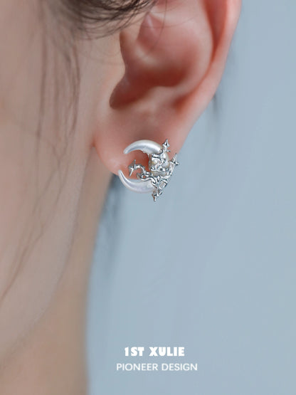 Silver gothic moon earrings featuring a crescent design with intricate detailing for a unique look
