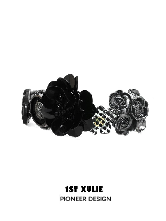 Stylish gothic rose bracelet featuring black floral designs and a unique charm