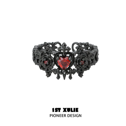 Gothic rose couple rings featuring intricate black design and a red heart-shaped gemstone