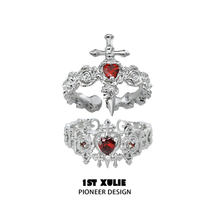 Gothic rose couple rings featuring intricate silver design and red gemstone accents