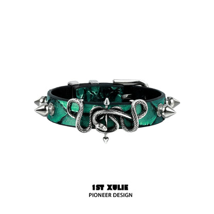 Gothic snake bracelet with emerald green accents and silver spikes for a bold fashion statement