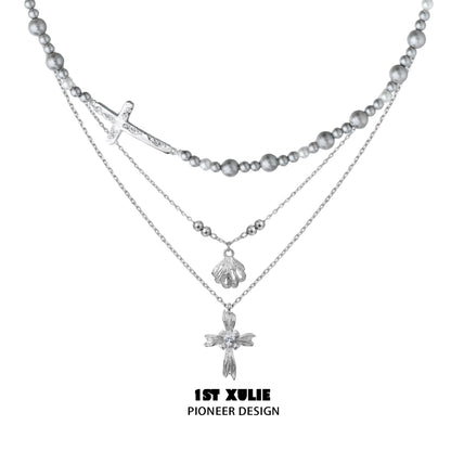 Gray pearl silver double layer necklace featuring a cross and decorative charms from 1ST XULIE