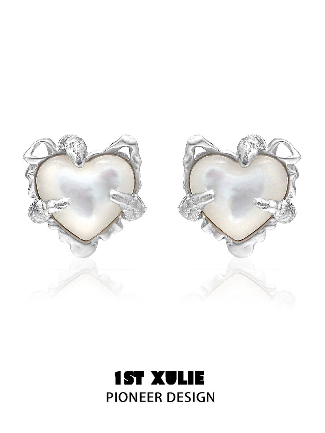 Silver heart ear clips for women with a unique pioneer design featuring a pearl center
