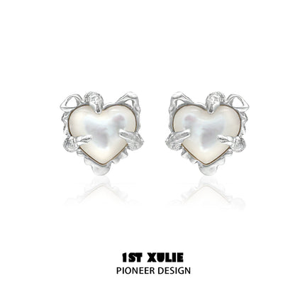 Elegant heart ear clips for women featuring a unique design with pearlescent detail
