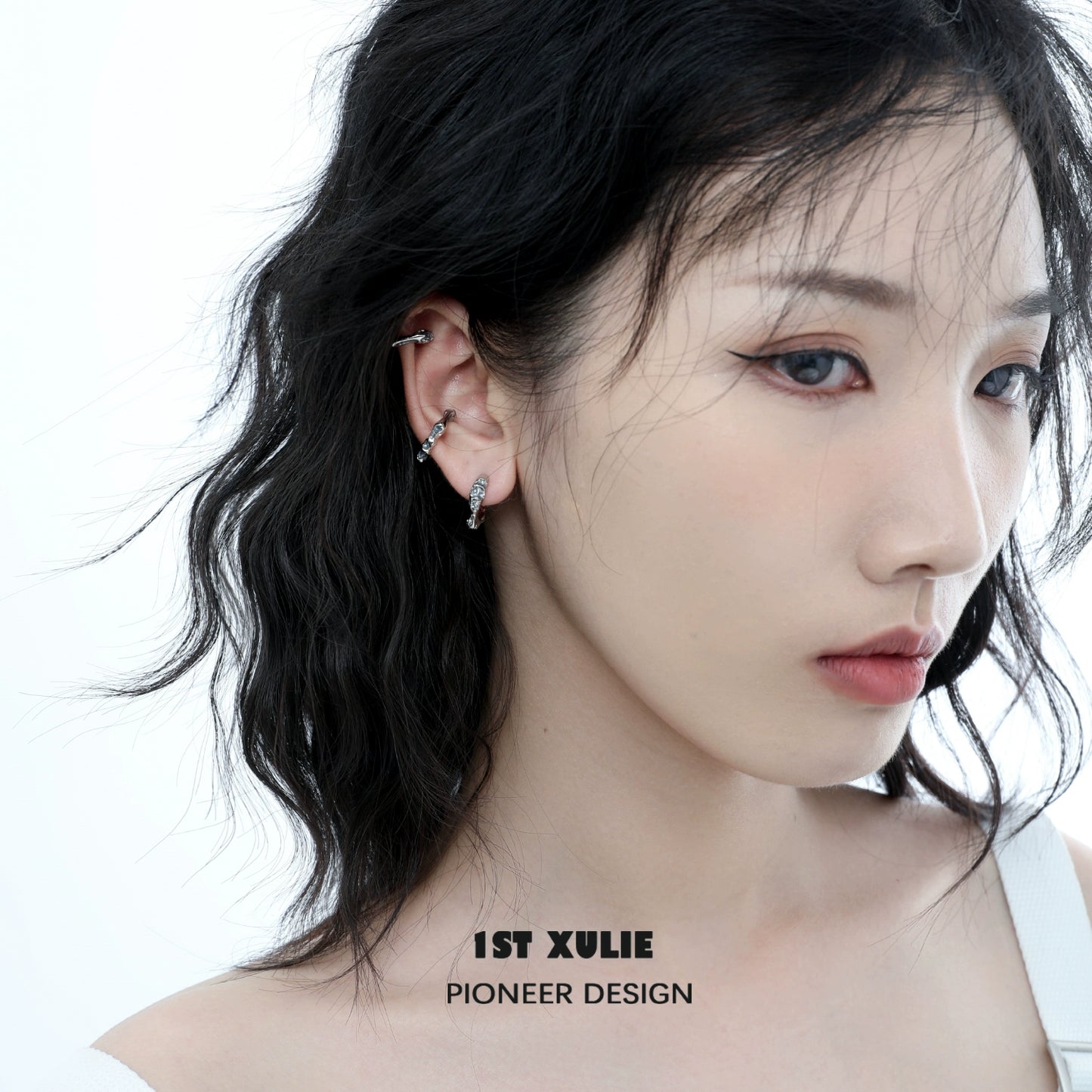 Stylish model wearing Icelandic snowfall earrings that add elegance to any outfit