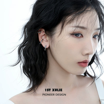Stylish model wearing Icelandic snowfall earrings that add elegance to any outfit