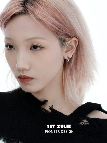 Chic model wearing Icelandic zircon ear cuffs, perfect for stylish accessory lovers