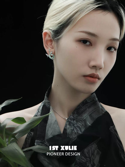 Elegant model wearing iris silver stud earrings, showcasing unique design and style