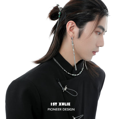 Stylish jade tassel earrings with unique design, worn by a model with long hair and contemporary fashion.