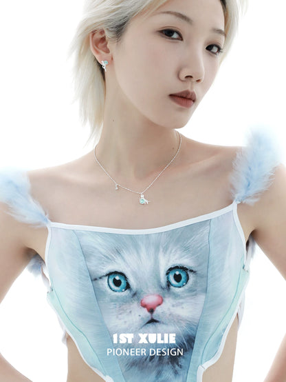 Model wearing a stylish kitten silver necklace with a sparkling charm and a cat-themed outfit