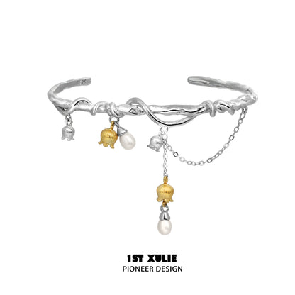 Stylish lily of the valley bracelet from 1STXULIE featuring unique charms and elegant design
