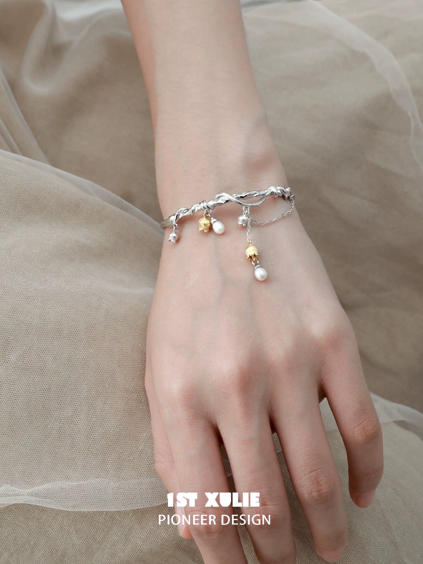 Elegant lily of the valley bracelet featuring silver accents and decorative charms, perfect for any occasion