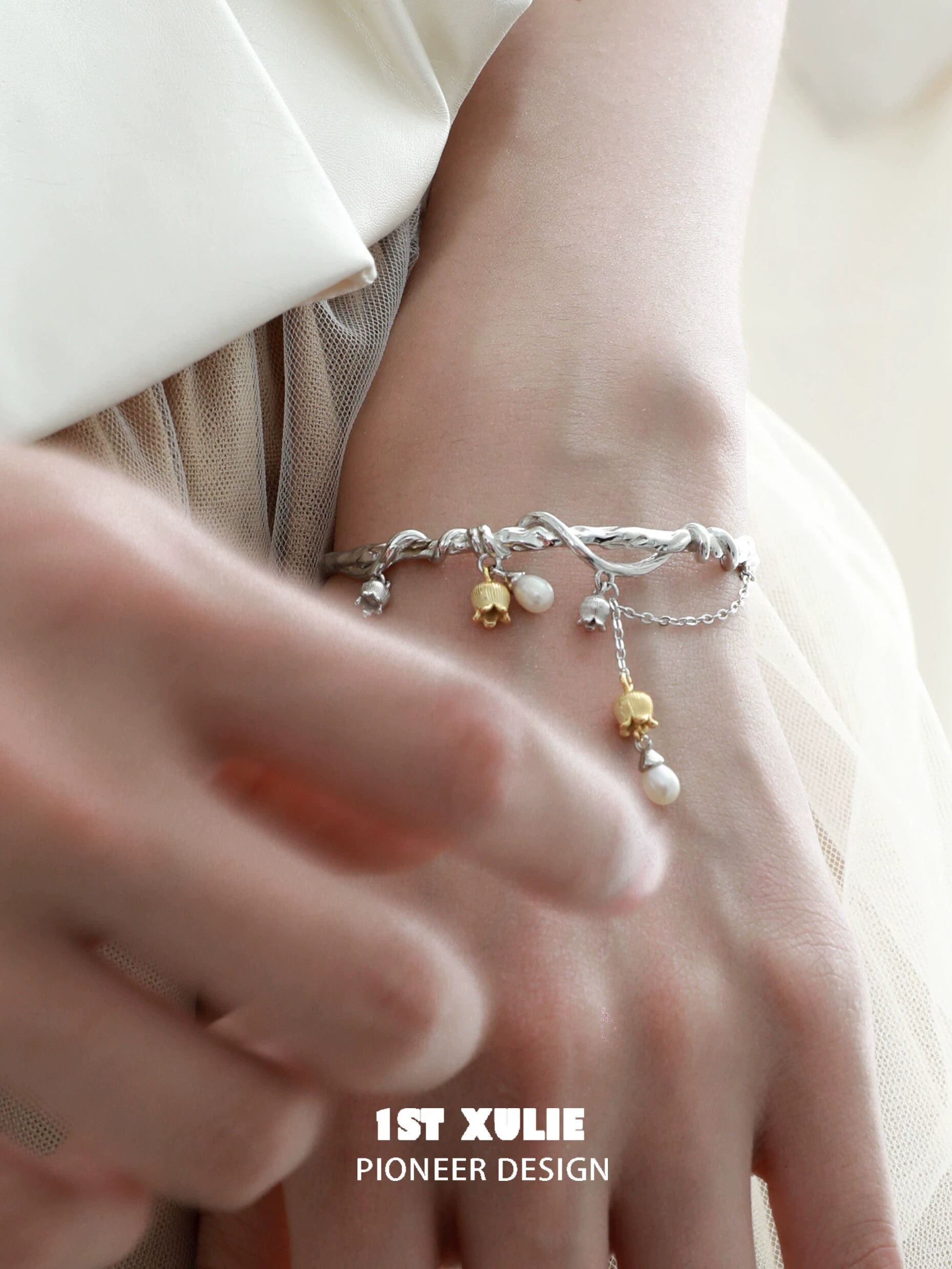 Elegant lily of the valley bracelet with silver accents and delicate pearl drops for a stylish look