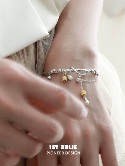 Elegant lily of the valley bracelet with silver accents and delicate pearl drops for a stylish look