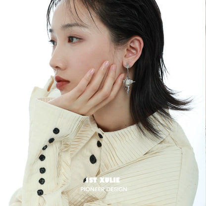Stylish model wearing luminous agate cross earrings that shimmer elegantly, perfect for any occasion