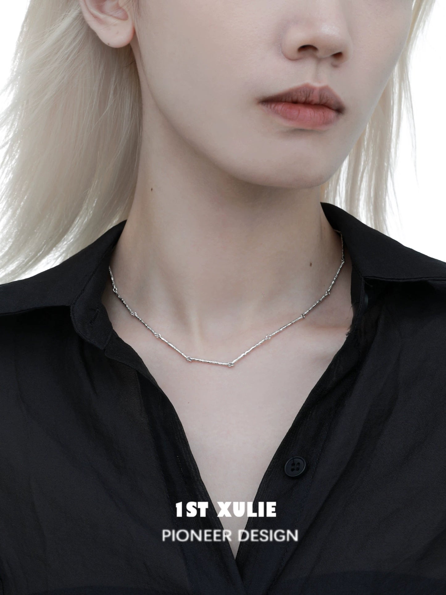 Minimalist bamboo necklace from 1STXULIE featuring a sleek and modern design worn on a model